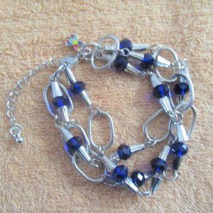 Triple-band silver loop bracelet with navy stones 8" + 2" extension